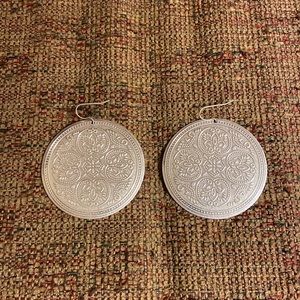 New, large, silver tone, patterned with fishhooks, round plate earrings.